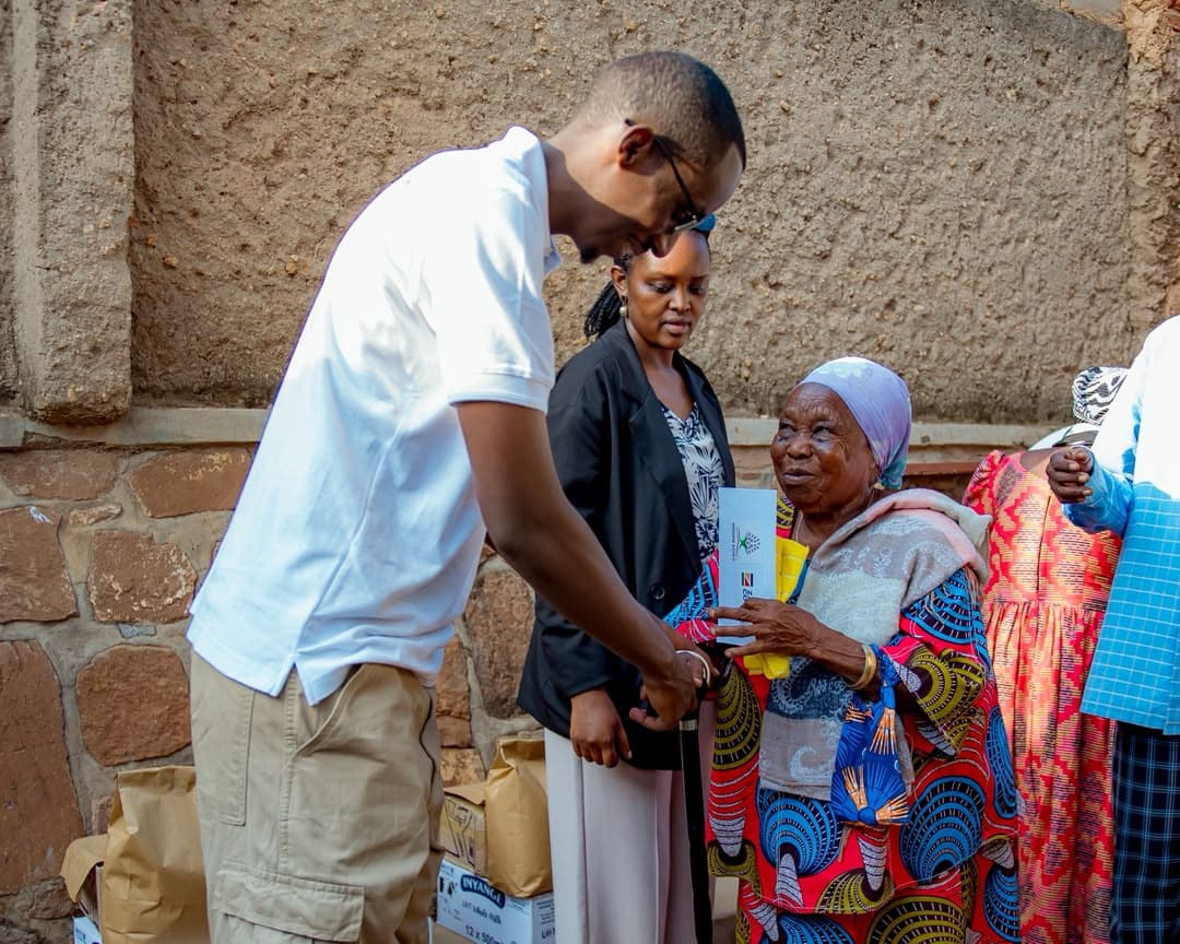 A Hidden Souls volunteer handing support materials to an older woman